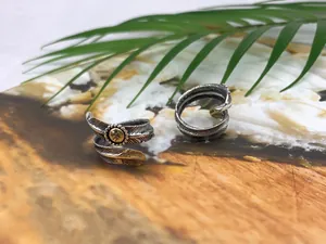 Close-up view of vintage S925 sterling silver Native American style feather wrap rings