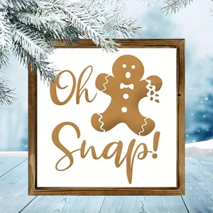 Close-up of a Christmas wooden frame decoration with gingerbread man and 'Oh Snap!' text