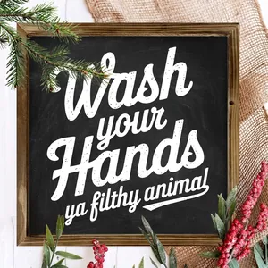 Close-up of rustic wooden wall decor sign featuring Wash Your Hands humor quote.