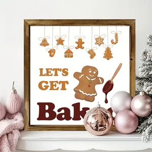 Close-up of wooden Christmas sign featuring gingerbread man and baking theme.