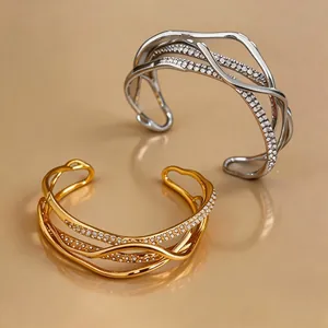 Luxury 18k gold plated multi-layer bangles with diamond-encrusted irregular design.