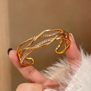 Luxurious 18K gold-plated multi-layer intertwined bangle set with sparkling diamond accents