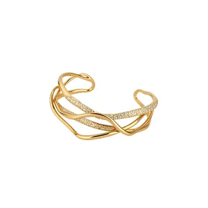 Elegant 18k gold plated multi-layered cuff bracelet featuring shimmering pavé-set crystals