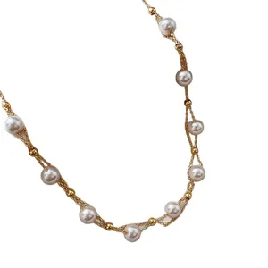 Elegant 18k gold plated necklace featuring delicate white pearl beads on a white background