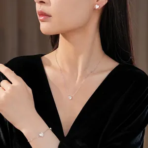 Elegant minimalist heart-shaped zircon jewelry set with necklace, earrings, and bracelet