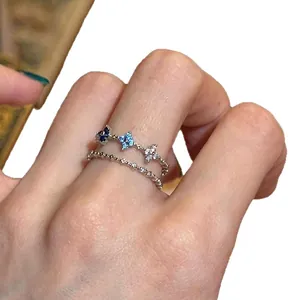 Chic double-layered silver ring featuring blue and white zircon floral elements