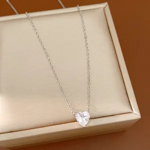 Detailed view of a silver-colored heart necklace with a sparkling CZ stone pendant