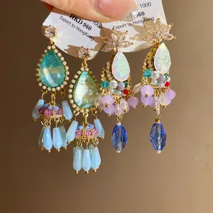 Detailed view of vintage palace style waterdrop tassel earrings with crystal beads