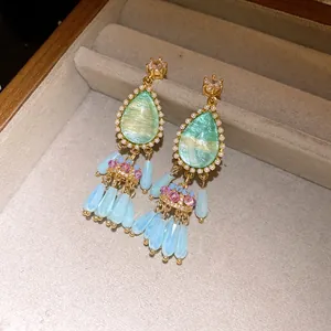 Detailed view of vintage court style waterdrop earrings with crystals and tassels