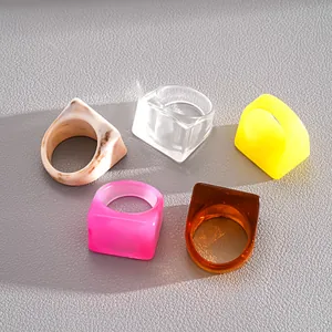 Set of 5 colorful chunky resin geometric rings in vibrant dopamine fashion style