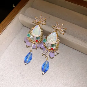 Detailed view of vintage court-style teardrop earrings featuring colorful crystals and beads