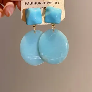 Blue resin geometric dangle earrings with retro square and oval design elements