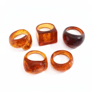 Set of 5 stylish chunky amber resin rings featuring geometric square and round shapes for women.