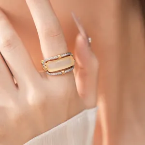 Elegant vintage style hollow ring featuring a rectangle stone and pavé white zircons
