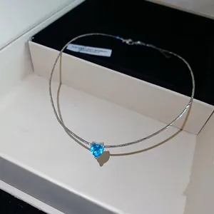 French style elegant silver choker necklace featuring a brilliant blue heart zircon pendant