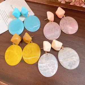 Detailed view of retro resin geometric drop earrings with marble texture in four colors.
