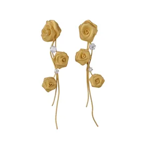 Elegant gold mesh rose tassel earrings with sparkling zircon accents for a chic look.