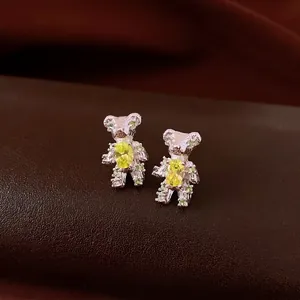 Elegant silver bear stud earrings with yellow zircon and vintage playful design for women