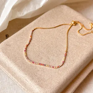 Detailed view of 18k gold plated bracelet with sparkling colorful zircons