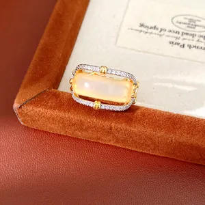 Detailed view of a vintage palace style hollow ring with zircon pavé and opalescent stone