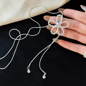 Detailed view of elegant zircon hollow flower pendant with adjustable silver snake chain