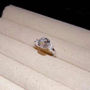 Detailed close-up of a silver-toned ring with a cushion-cut square cubic zirconia