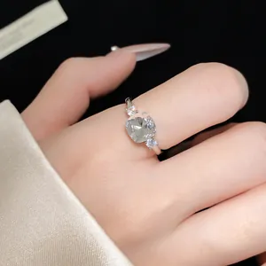 Exquisite macro detail of a square-cut sparkling zircon ring on an adjustable silver band