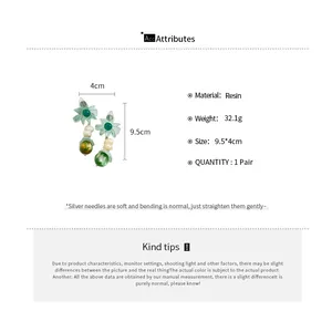 Detail view of floral resin drop earrings showing exact size and weight parameters