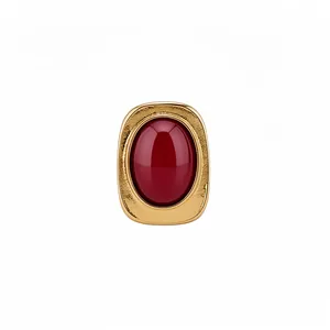 Elegant vintage gold-tone open ring featuring a large oval red resin cabochon stone