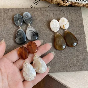 Retro resin teardrop earrings with marble texture in elegant earth tones for women.