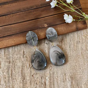 Grey marble resin teardrop earrings with vintage aesthetic and gold accents