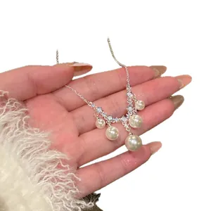 Elegant French vintage style silver necklace featuring square zircons and delicate pearl pendants.
