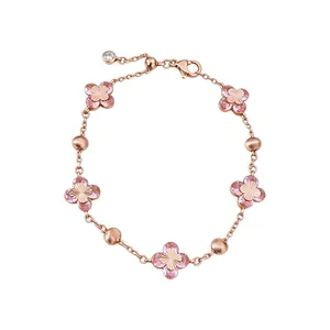 Rose gold charm bracelet featuring pink zircon clover flowers and dainty round beads