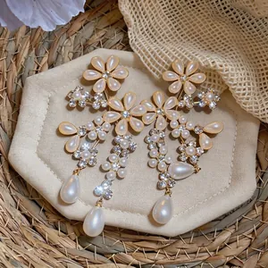 Vintage French court style earrings with flower patterns and teardrop pearl drops