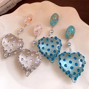 Vintage resin heart earrings with inlaid rhinestones in palace style and silver needles