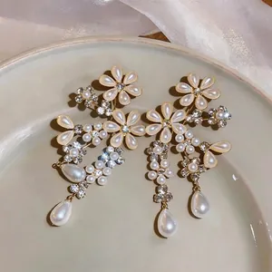 Elegant French court style floral pearl earrings with teardrop dangles and rhinestones