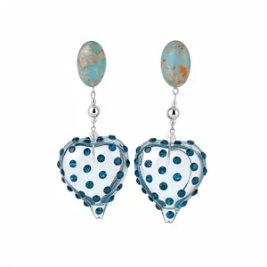 Vintage resin heart earrings with blue crystals and silver pins for a palace style look.