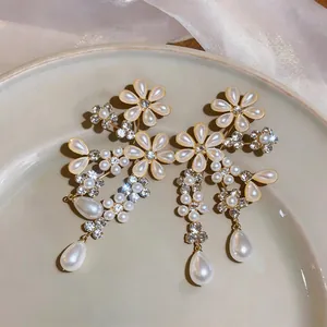 Elegant French palace style pearl flower drop earrings with sparkling rhinestones