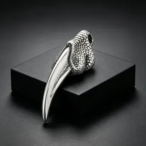 Close-up macro view of punk style stainless steel wolf tooth claw pendant jewelry for men
