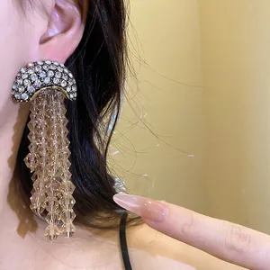 Elegant champagne crystal tassel earrings with sparkling rhinestones and silver needles