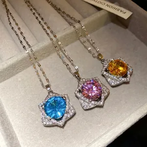 Elegant star-shaped pendant necklace with colorful round crystals displayed in a box