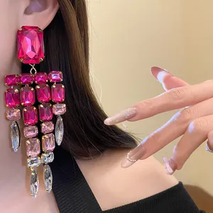 Close-up detail of fuchsia and pink crystal rectangular tassel earrings for women