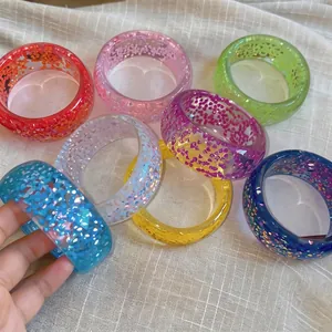 Vibrant dopamine style colorful resin bangles with sparkling glitter confetti inclusions