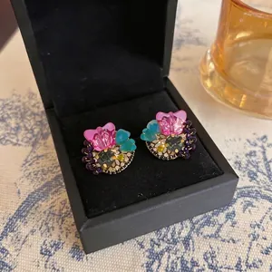 Elegant colorful butterfly stud earrings with rhinestones presented in a black jewelry box