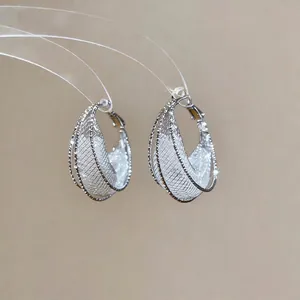 Elegant silver mesh hollow crescent hoop earrings featuring sparkling crystal accents for women