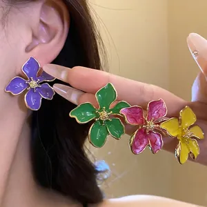 Handcrafted vibrant colorful flower stud earrings featuring a sweet holiday vacation style for women