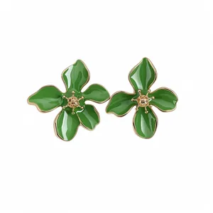 Elegant green enamel flower stud earrings with silver pins for a fresh summer look.