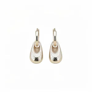 Elegant textured gold water drop pendant hoop earrings with a vintage minimalist design.