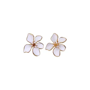 Elegant vintage style white enamel flower stud earrings with gold-toned petal edges