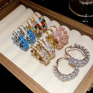 Vintage wheat ear hoop earrings with colorful cubic zirconia displayed in a jewelry box
